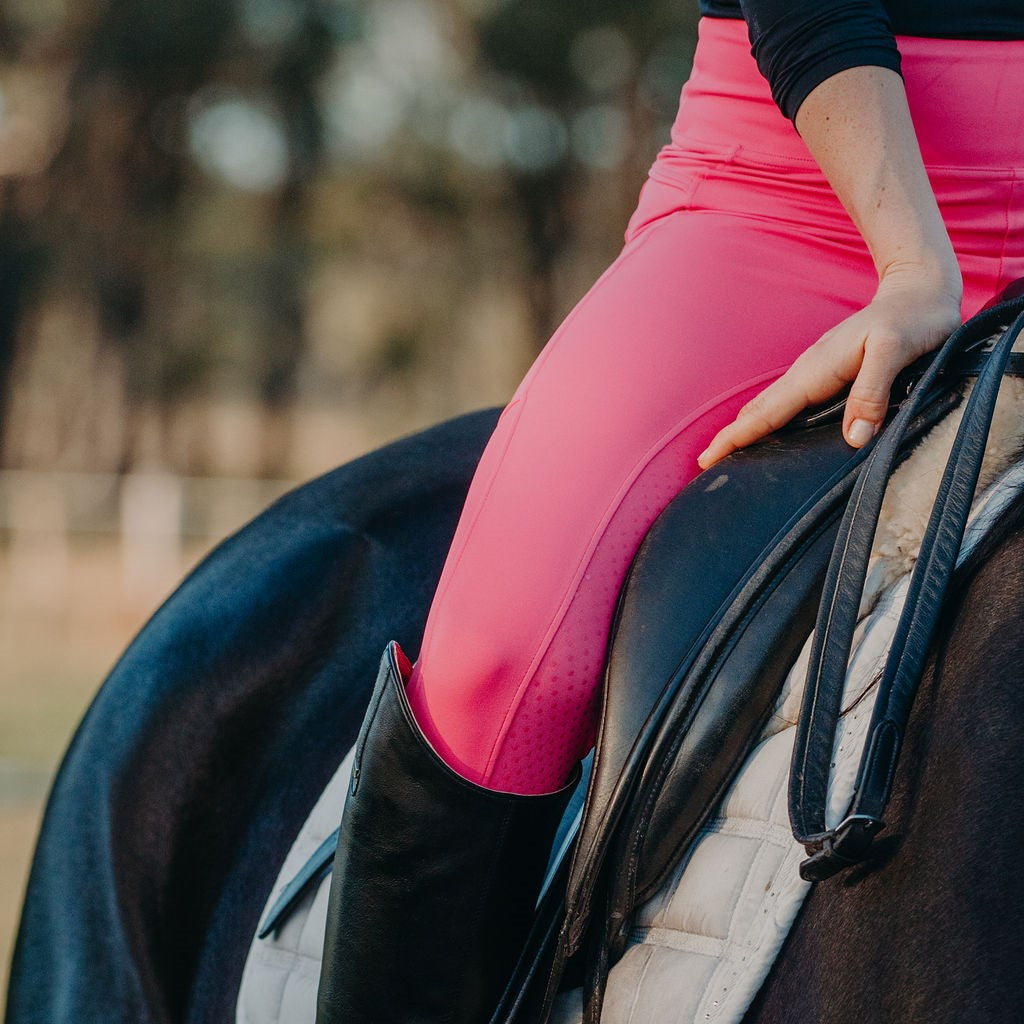 Hot Pink riding tights worn by girl on horse